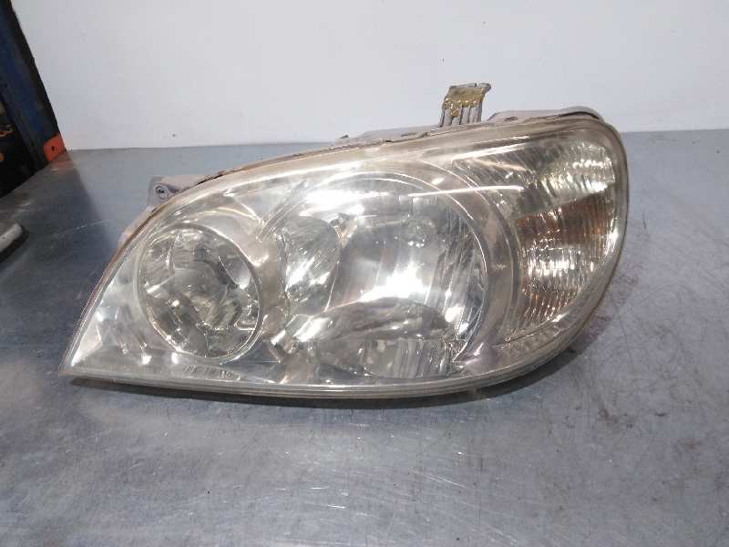 Recambio de faro izquierdo para kia carnival ii 2.9 cdri ex referencia OEM IAM  BIFARO SOPORTE PEGADO
